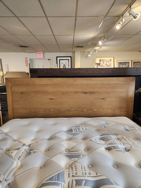 The Magnussen B6309 Davenport Queen Storage Bed is featured in a mid-century modern bedroom.