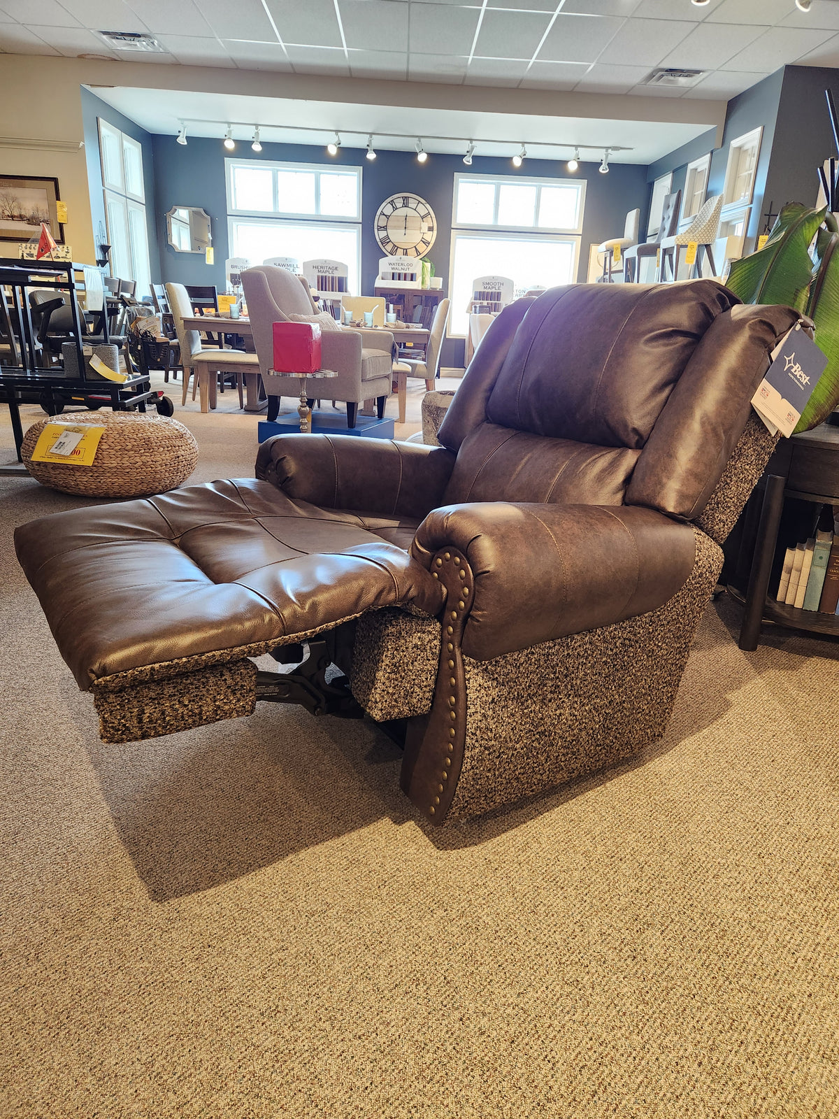 Best FS9N64LF Garnet Reclining Chair with built-in USB, brown leather, showcased in a reclining collection showroom.