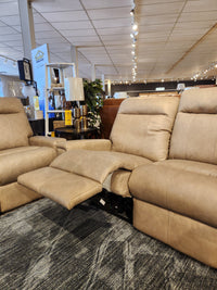 The Decor-rest M8520 Power Reclining Sofa, beige, Canadian-made with adjustable lumbar support, shown in a showroom.