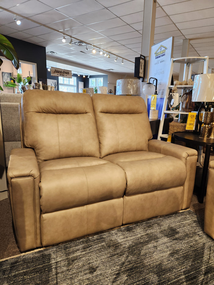 The Decor-rest M8520 tan leather power reclining loveseat with power lumbar is shown on a gray patterned rug.