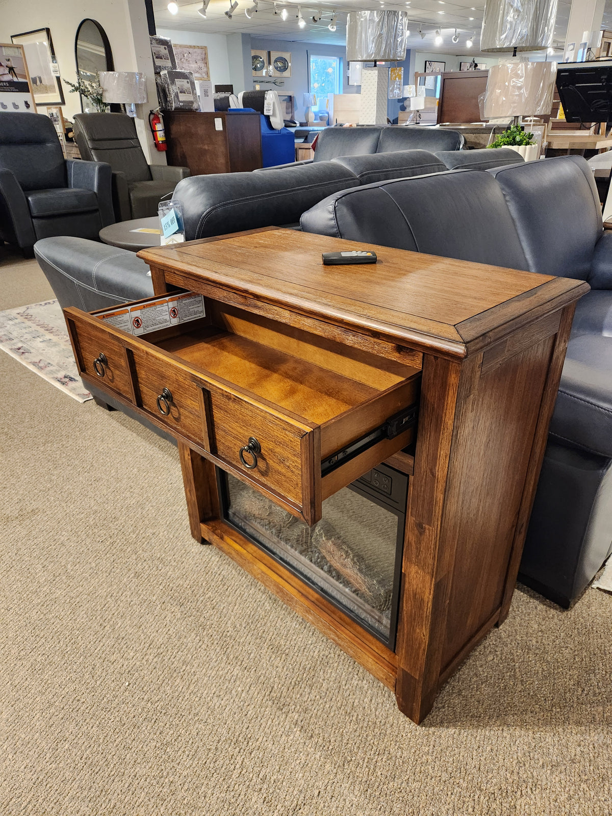 Jofran 1900 Bakersfield 32" Fireplace with three open drawers and remote, ideal for saving space in any room.