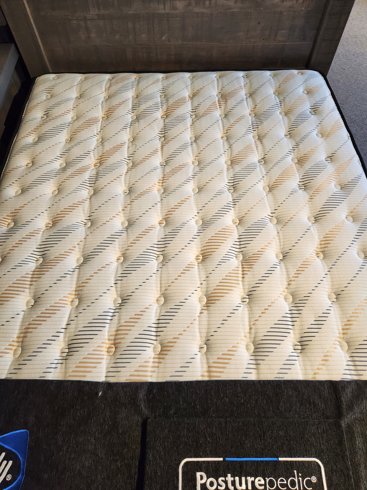 The Sealy Cyra TT Firm 1000 Coil Copper Series mattress with a quilted top is ideal for hot sleepers in showrooms.