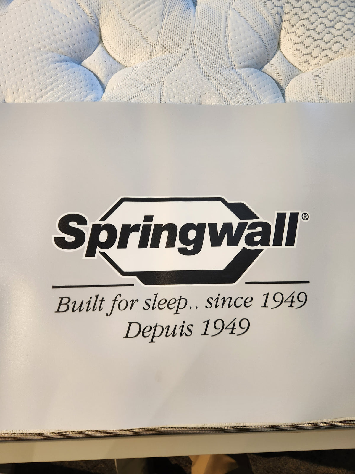 Springwall logo with "Built for sleep.. since 1949" on a Springwall Michelle ET Medium Mattress tag.