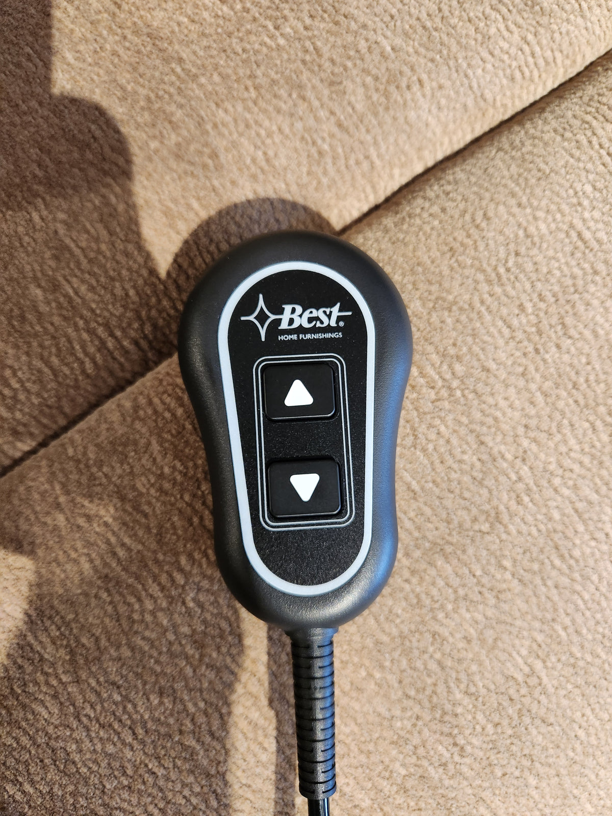 Black remote with up/down arrows labeled "Best" rests on the Maverly 9N11 Lift Chair recliner.