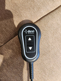Black remote with up/down arrows labeled "Best" rests on the Maverly 9N11 Lift Chair recliner.