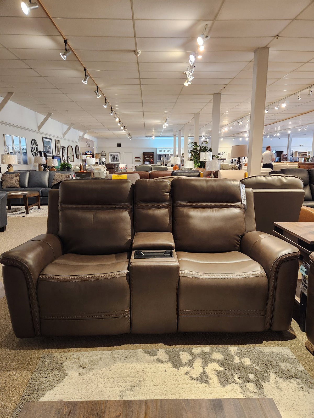 Donald Choi San Antonio Power Recliner Loveseat-520356 in dark brown leather with console on showroom display.