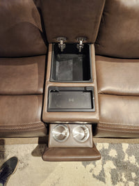 Donald Choi San Antonio Power Recliner Loveseat-520356: brown leather, center console, cup holders, storage, wireless charging.