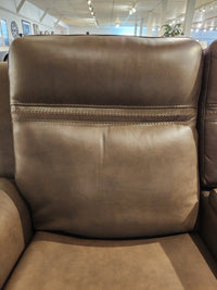Close-up of the San Antonio Power Recliner Loveseat-520356 by Donald Choi in a bright furniture showroom.