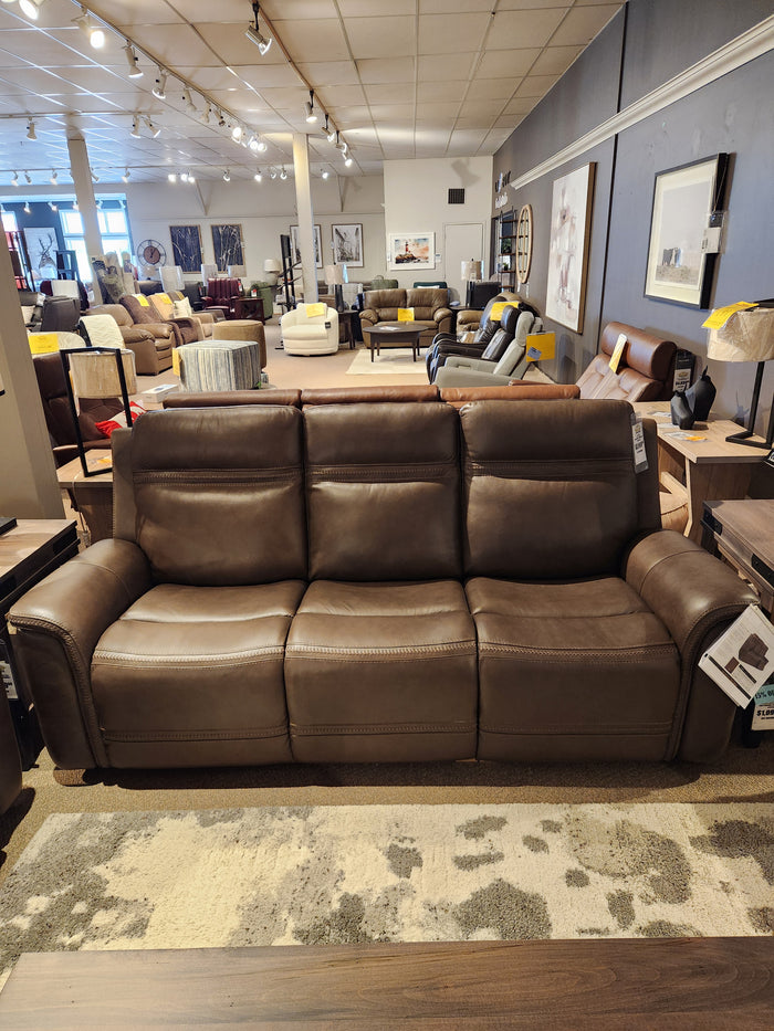 The Donald Choi San Antonio Power Recliner Sofa-520356 features adjustable lumbar support and top grain brown leather.