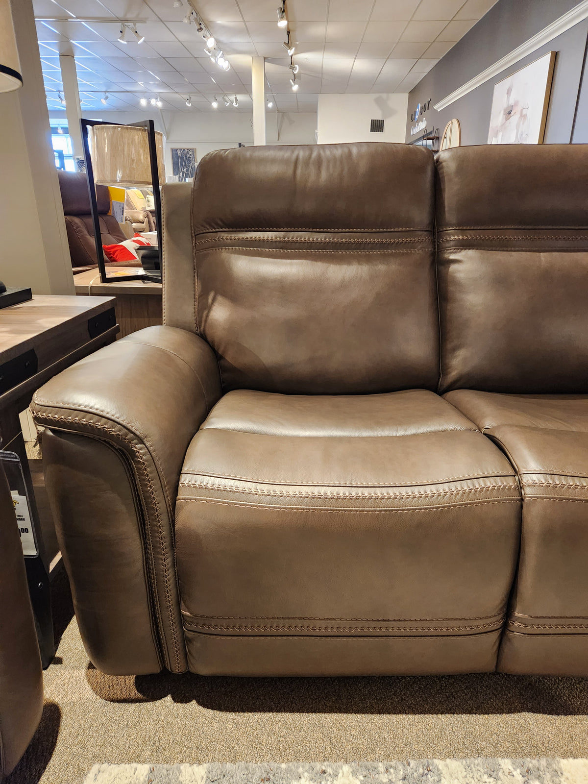 Donald Choi San Antonio Power Recliner Sofa-520356 on display with adjustable lumbar support and power reclining.