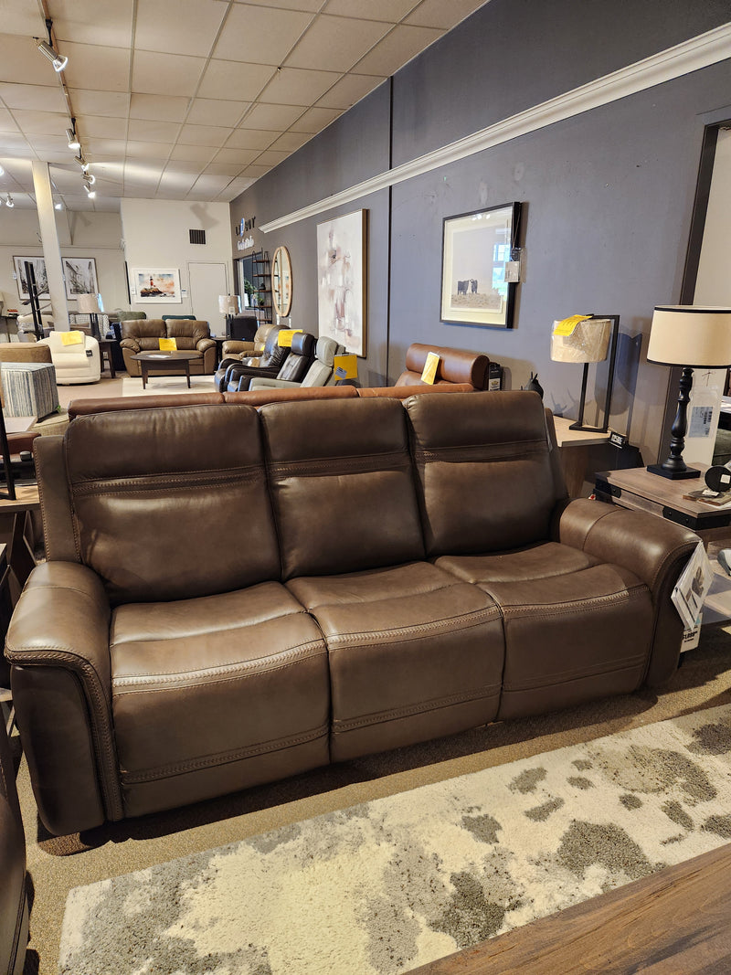 16 WEST San Antonio Power Recliner Sofa-520356 shown in a showroom with lamps, tables, and wall art.