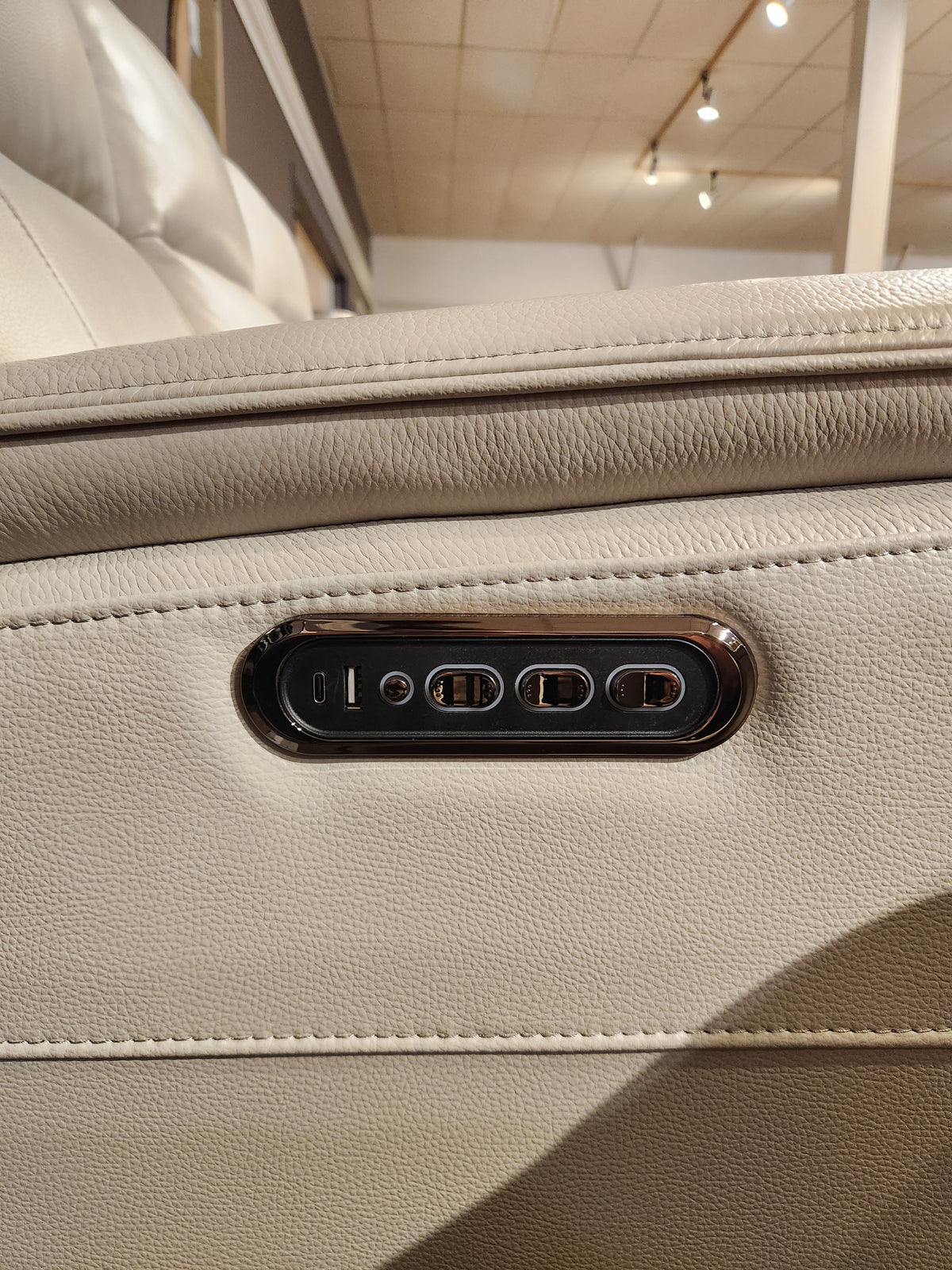 16 WEST Austin Power Recliner Sofa-520157 side panel with USB port and four seat adjustment buttons shown close-up.