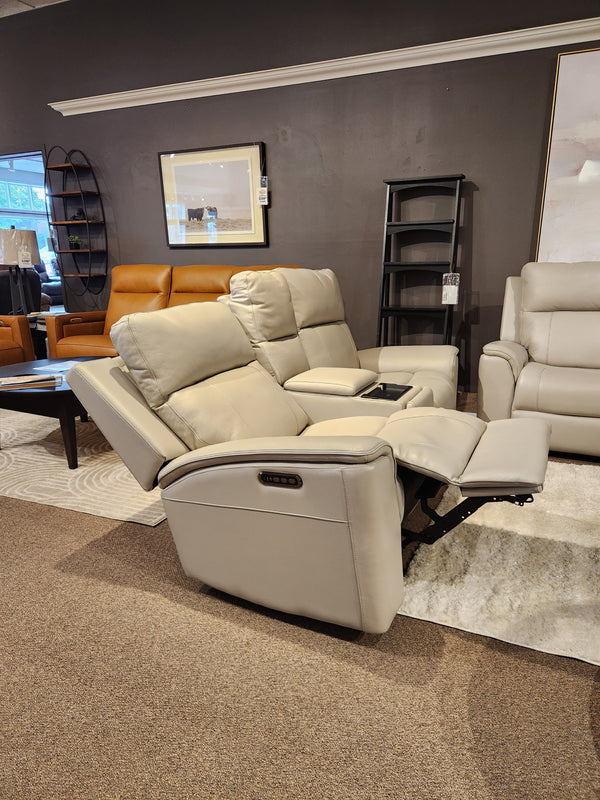 16 WEST Austin Power Recliner Loveseat-520157 in light gray with cup holders and lumbar support, amidst chic decor.