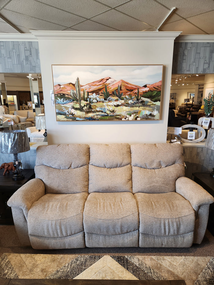 La-z-boy 521 James Sofa, beige, three seats, showroom display with desert painting and lamps on side tables.