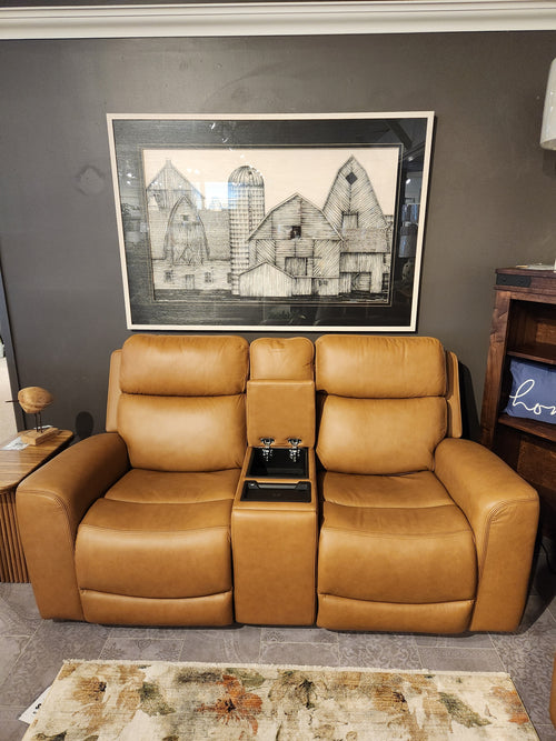 Two Denver 2 Power Recliner Loveseats by 16 WEST with lumbar support sit below a framed barn art on a dark wall.