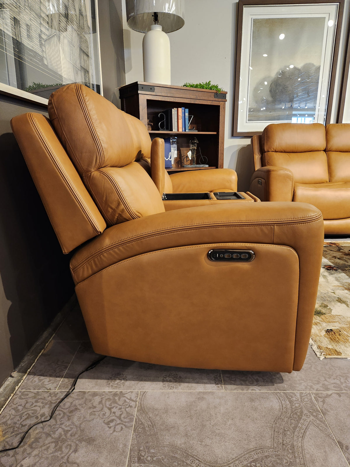 16 WEST Denver 2 Power Recliner Loveseat-520256-003 with memory foam and lumbar support, near a bookshelf and lamp.