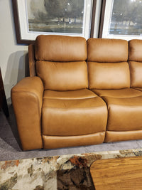 16 WEST Denver 2 Power Recliner Sofa-520257-003 with lumbar support, wide arms, on a rug near a wooden table.
