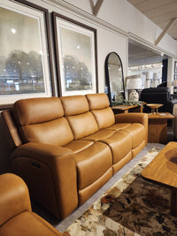 16 WEST Denver 2 Power Recliner Sofa-520257-003 with lumbar support, set amid framed art, mirror, and chic tables.