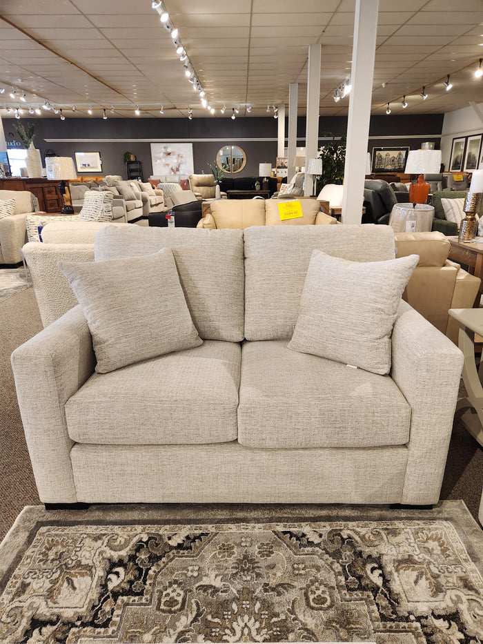 The Superstyle 9540 Stationary Loveseat features a cushioned back—ideal for modern spaces and pairs well with sofas.
