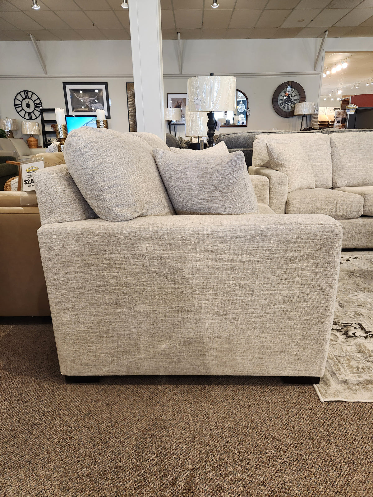 Side view of the Superstyle 9540 Stationary Loveseat with two large cushions, ideal for modern living spaces.