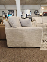 Side view of the Superstyle 9540 Stationary Loveseat with two large cushions, ideal for modern living spaces.
