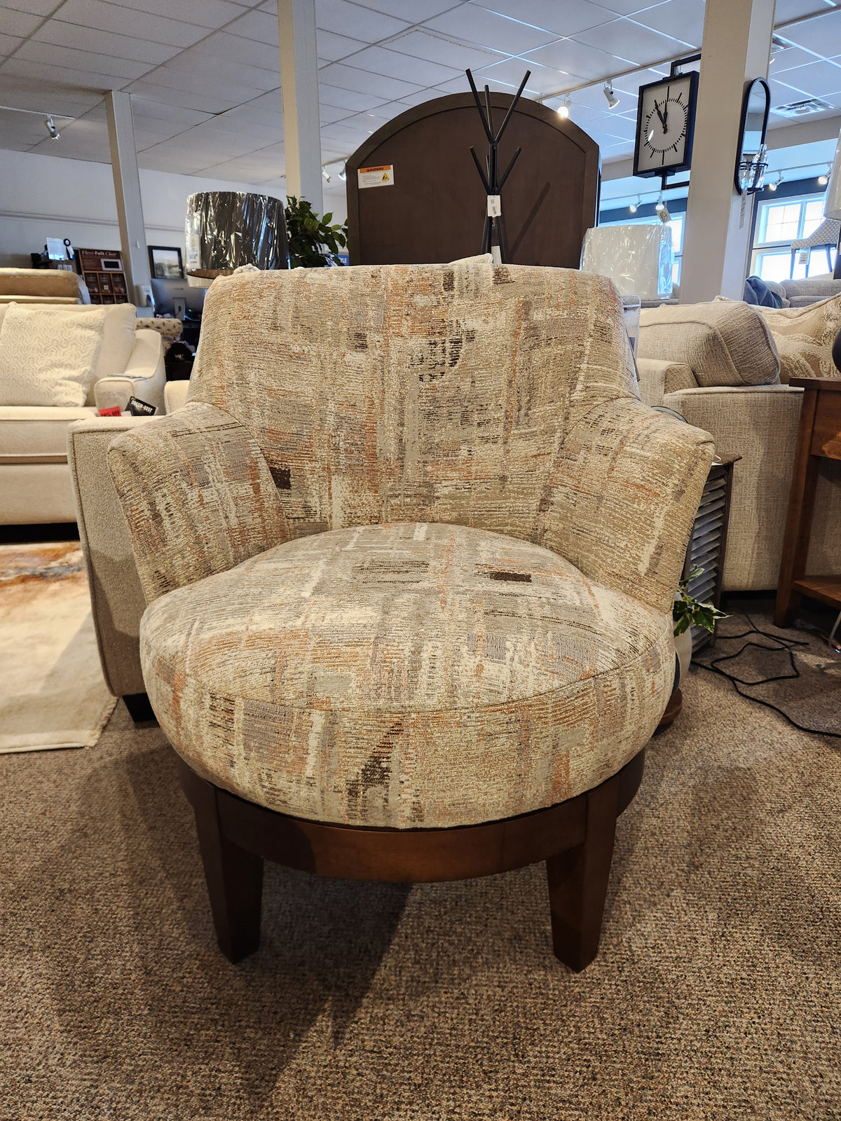 Best Ronan 2908 Swivel Chair: Upholstered, abstract pattern with wood swivel base—perfect for a stylish showroom.