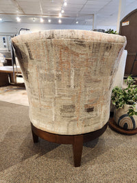 Best Ronan 2908 Swivel Chair: Upholstered accent chair with patterned fabric, wood swivel base, showroom back view.