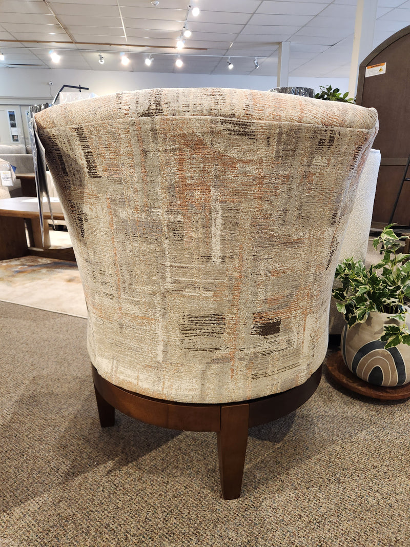 Best Ronan 2908 Swivel Chair: Upholstered accent chair with patterned fabric, wood swivel base, showroom back view.