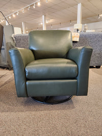 The Leather Craft 745 Leather Swivel Rocker Chair in green is handmade in Toronto and displayed on our carpeted showroom floor.