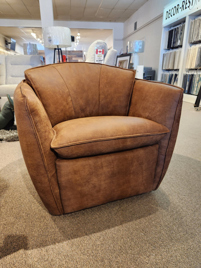 A Leather Craft 752 Swivel Chair sits on a carpeted floor, surrounded by elegant furniture and decor.