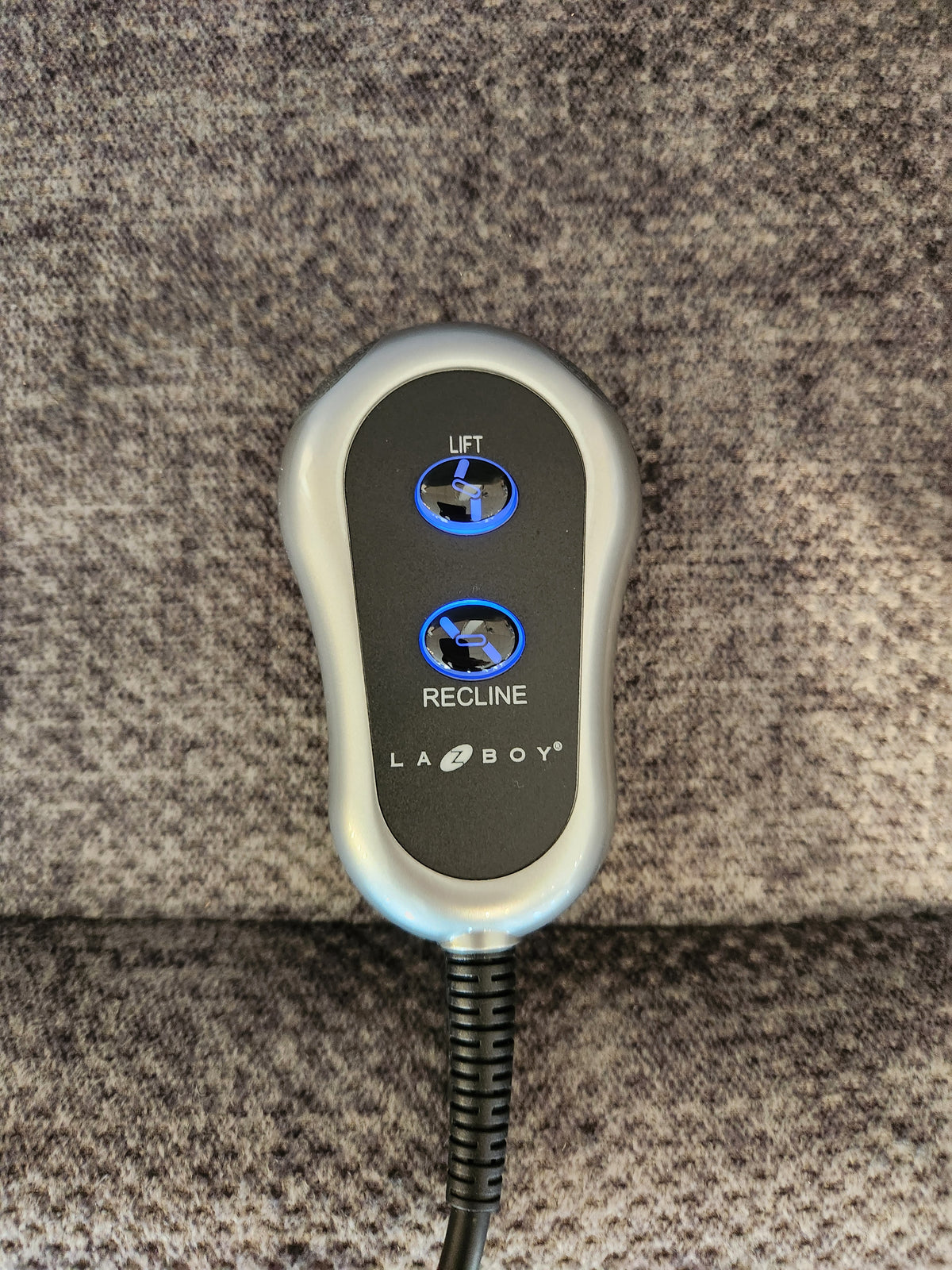 La-Z-Boy 793 Jean Bronze Lift Chair remote with "Lift" and "Recline" buttons on gray upholstery.