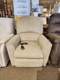 La-z-boy 793 Jean Bronze Lift Chair in beige fabric with remote, shown in furniture store showroom.