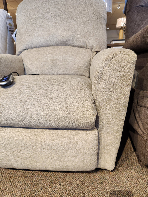 La-z-boy 793 Jean Bronze Lift Chair, petite, light beige, with remote on armrest, shown on carpeted floor.