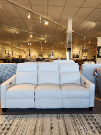 A La-Z-Boy 810 Quinault Power Reclining Sofa with Zero G & Headrest shown in a showroom among other sofas and lights.