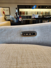 Close-up of the La-Z-Boy 810 Quinault Power Reclining Sofa w/ Zero G & Headrest; fabric samples in background.