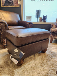 The Best F24ELU Noble Leather Ottoman pairs with a matching armchair and looks great on a beige rug.