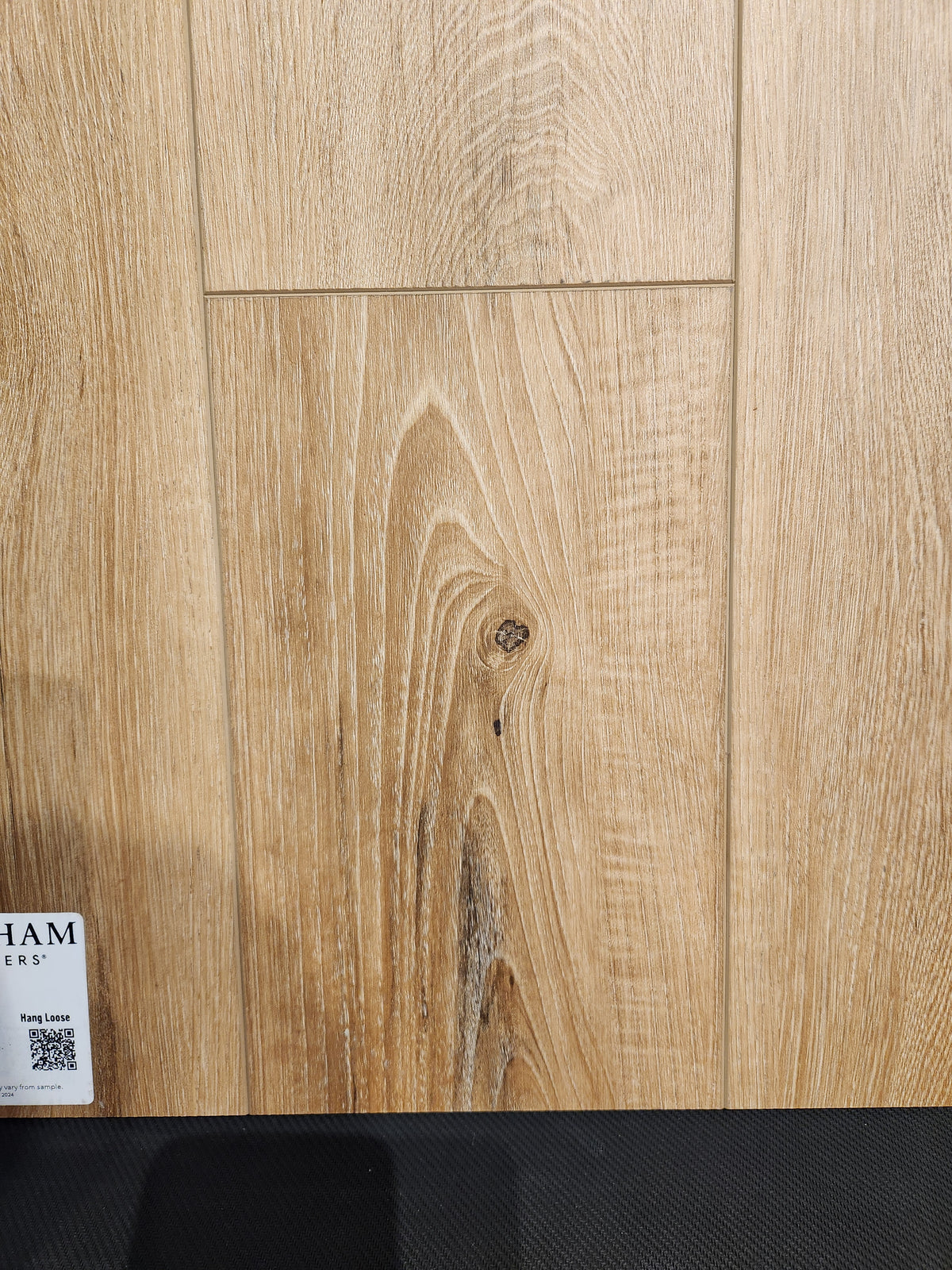 Little Ben XL Luxury Vinyl Click Plank by Beckham Brothers offers a durable, wood-grain showroom flooring sample.