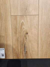 Little Ben XL Luxury Vinyl Click Plank by Beckham Brothers offers a durable, wood-grain showroom flooring sample.