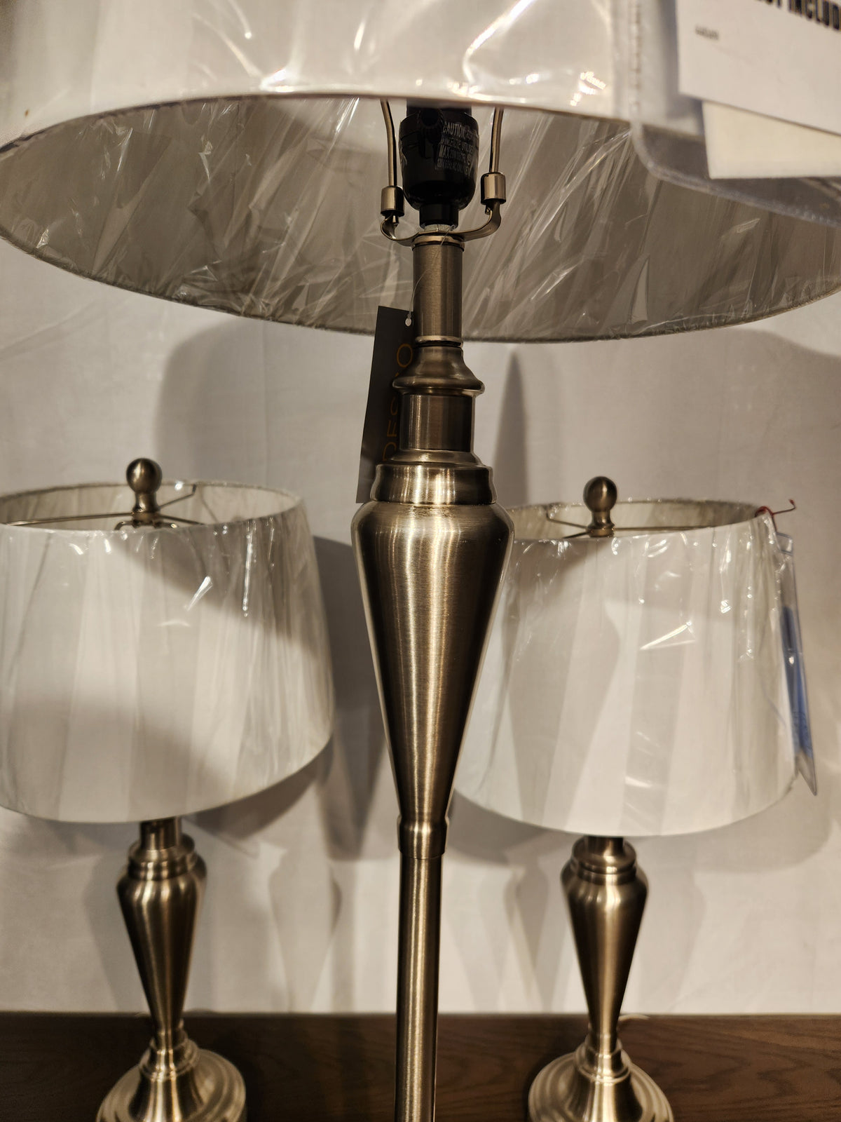 Adesso Lamp Glendale 3 Piece Lamp Set with white shades, shown in protective plastic on a wooden surface.