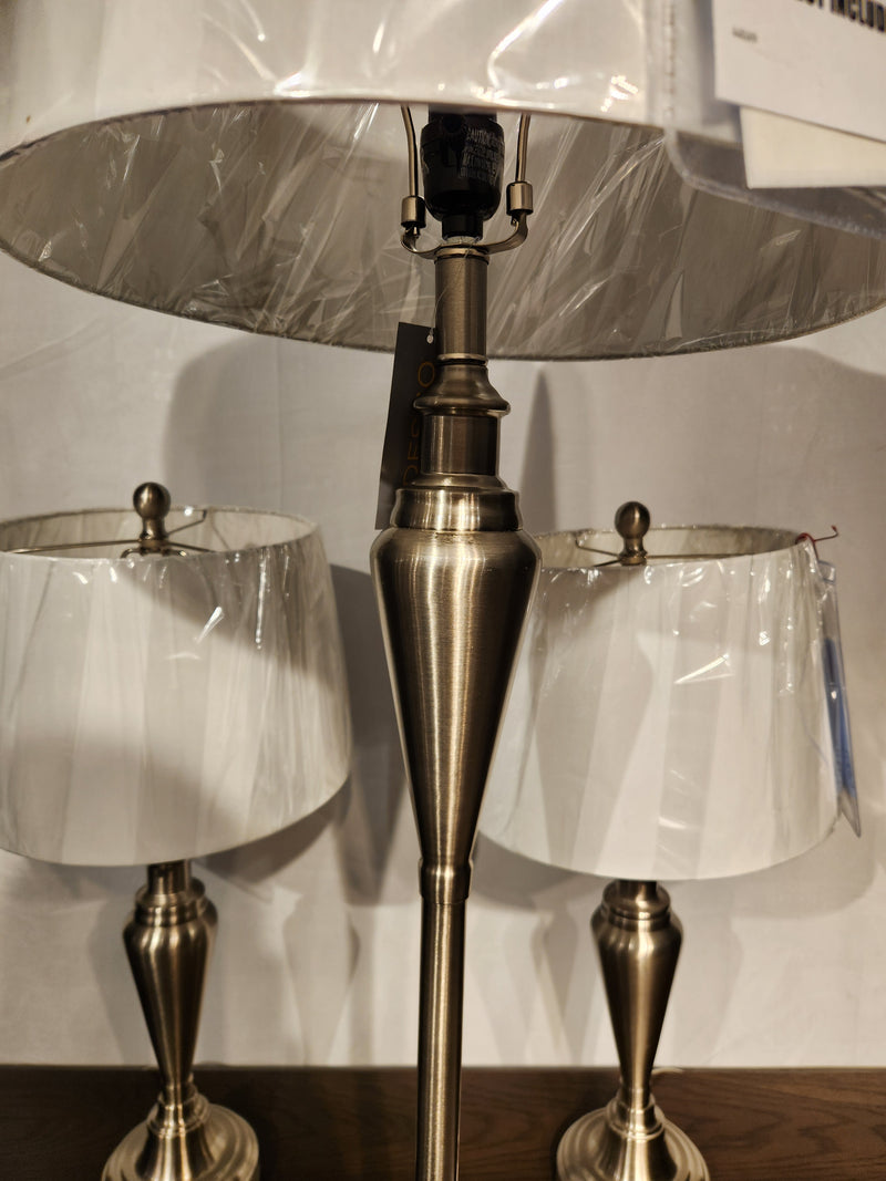 Adesso Lamp Glendale 3 Piece Lamp Set with white shades, shown in protective plastic on a wooden surface.