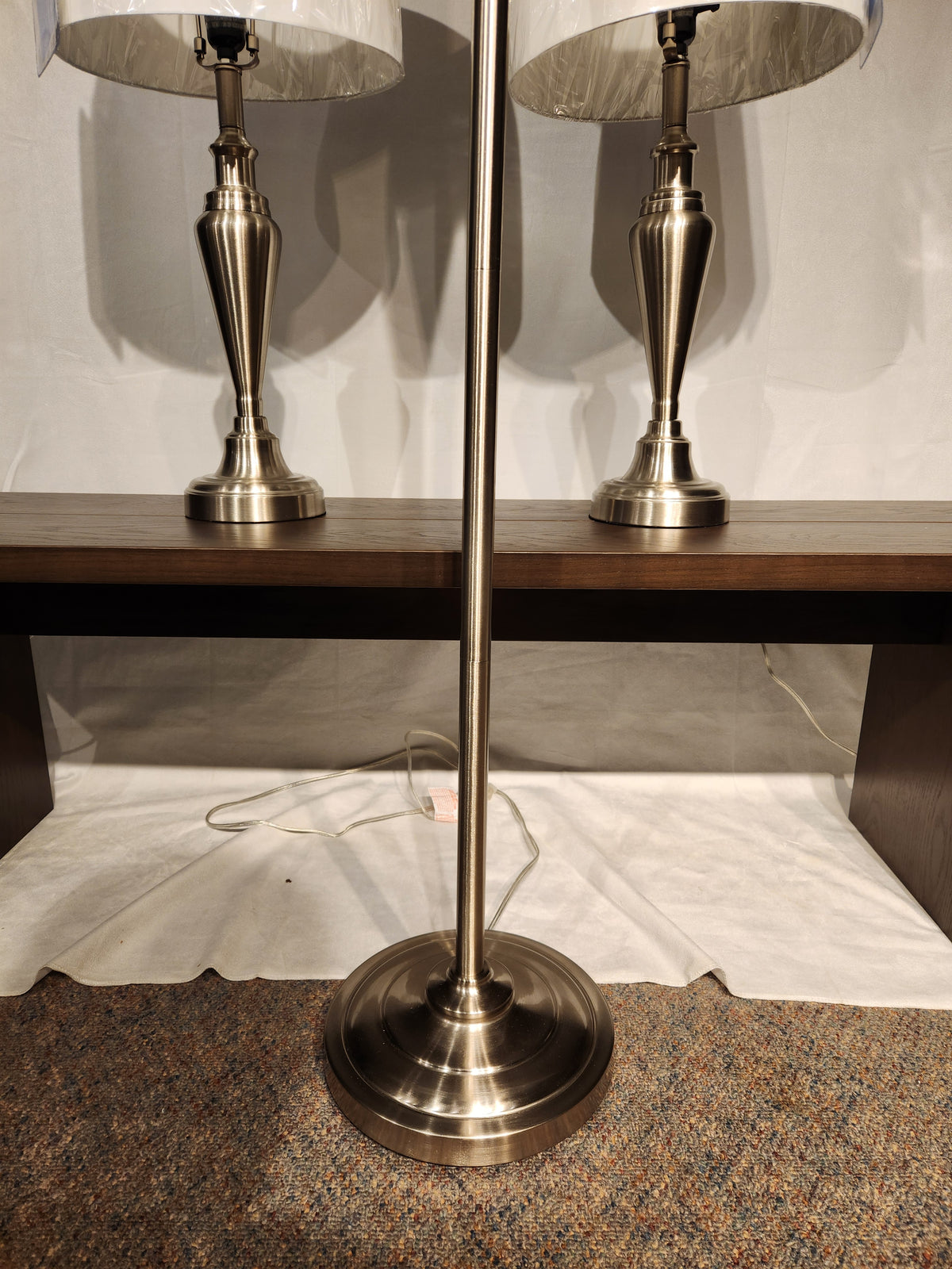 The Glendale 3 Piece Lamp Set by Adesso Lamp features a floor lamp and two table lamps in antique brass with visible cords.