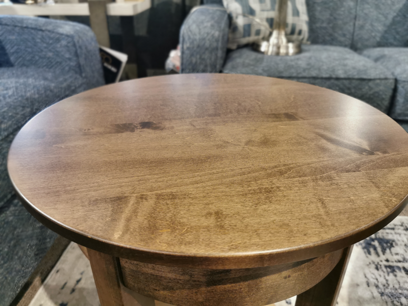The Handstone Demi-Lune Chairside Table brings eclectic elegance between two blue chairs in your living room.