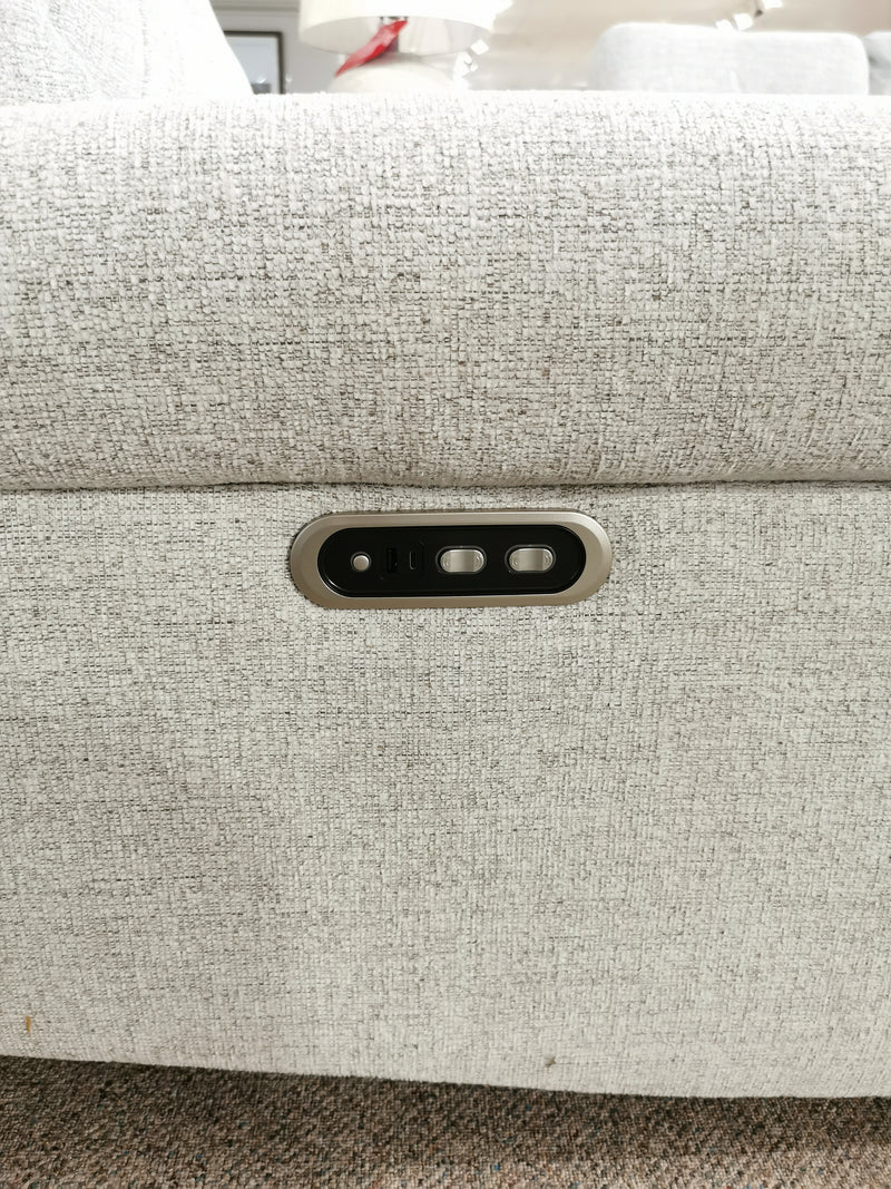 Close-up of the M8508 Power Reclining Chair's fabric armrest by Decor-rest, featuring a rectangular panel with electronic control buttons that seamlessly integrate lumbar support for enhanced comfort.