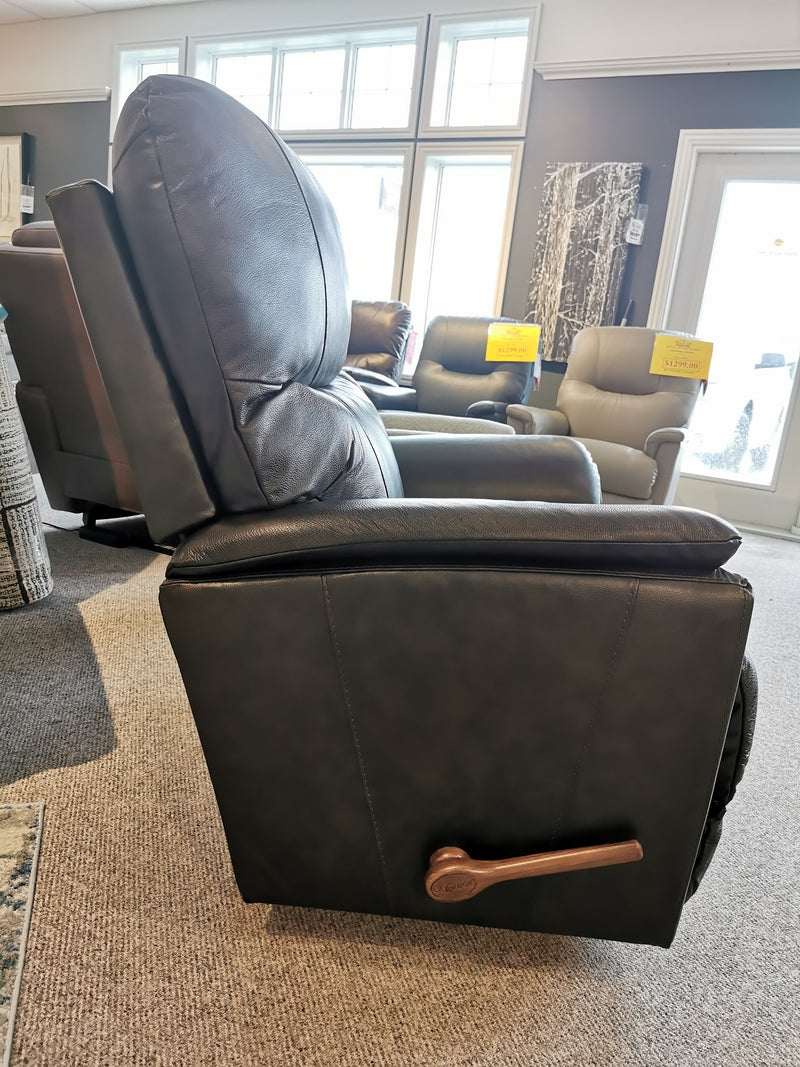 Side view of the La-z-boy 724 Trouper Wall-away Recliner with lumbar support and wood lever, shown among other chairs.