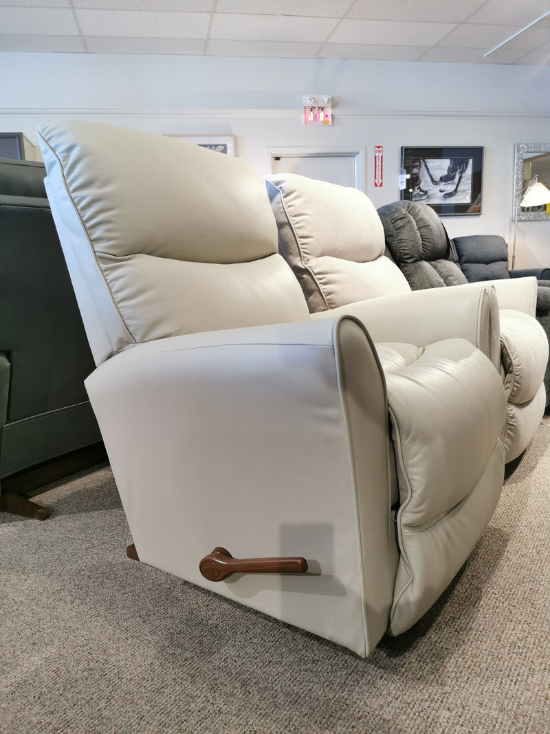Side view of a light gray La-Z-Boy 765 Rowan Leather Rocker Recliner with wooden lever, stylishly set in a showroom.