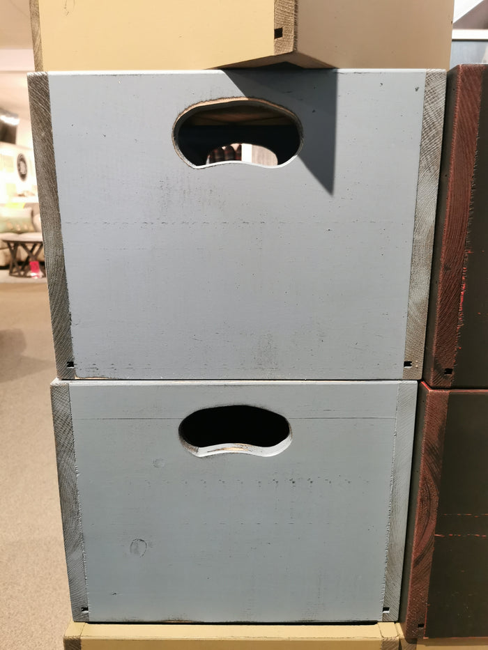 Two stacked Mercana SB101 record crates with oval handles, ideal for vinyls on a beige carpeted floor.