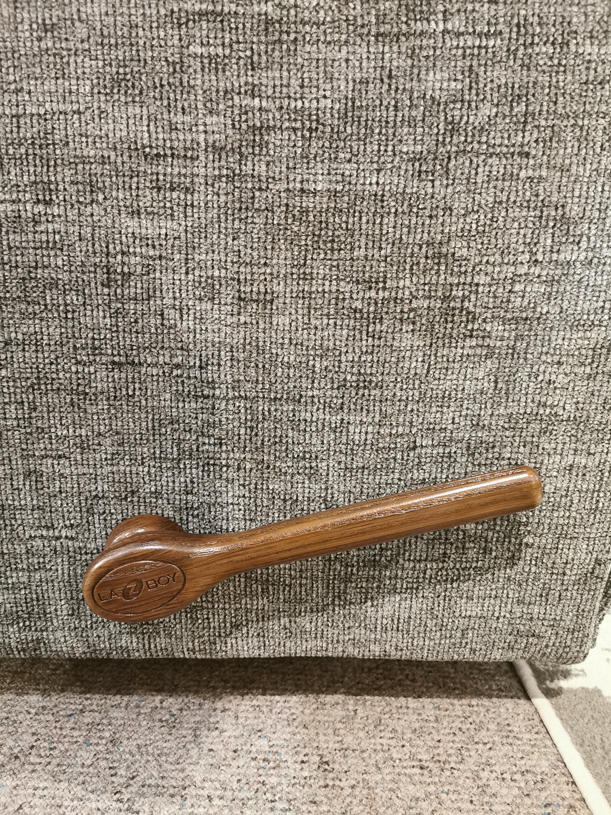 Wooden door handle on textured gray carpet, enhancing elegance in your La-z-boy 706 Jay Rocker Recliner space.