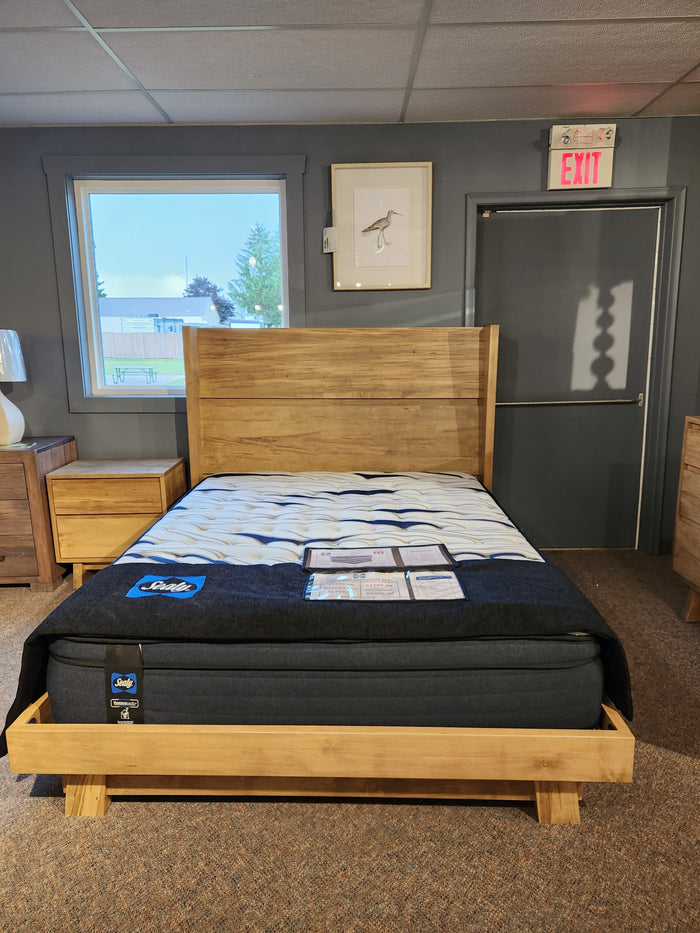 The Handstone JA-QW Jasper Queen Platform Bed is showcased with nightstands, wall art, and a window in a showroom.