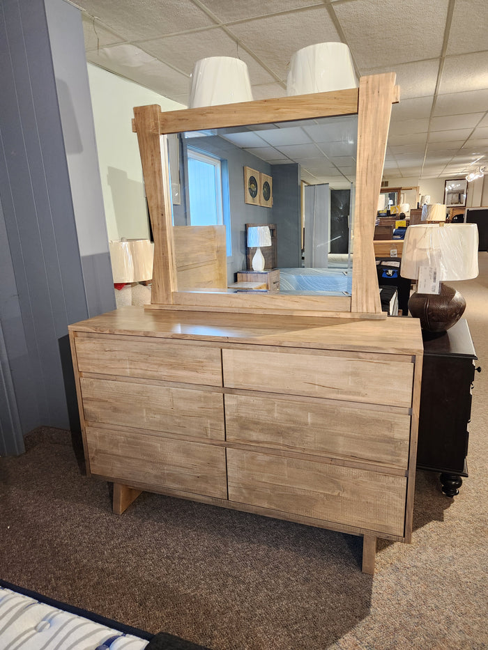 Handstone JA18 6 Drawer Dresser with mirror, light wood, shown in a showroom.
