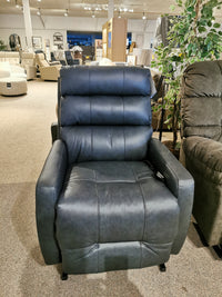 The Kristisha 9NZ31LV Power Lift Chair by Best showcases a modern black leather design in a stylish showroom.